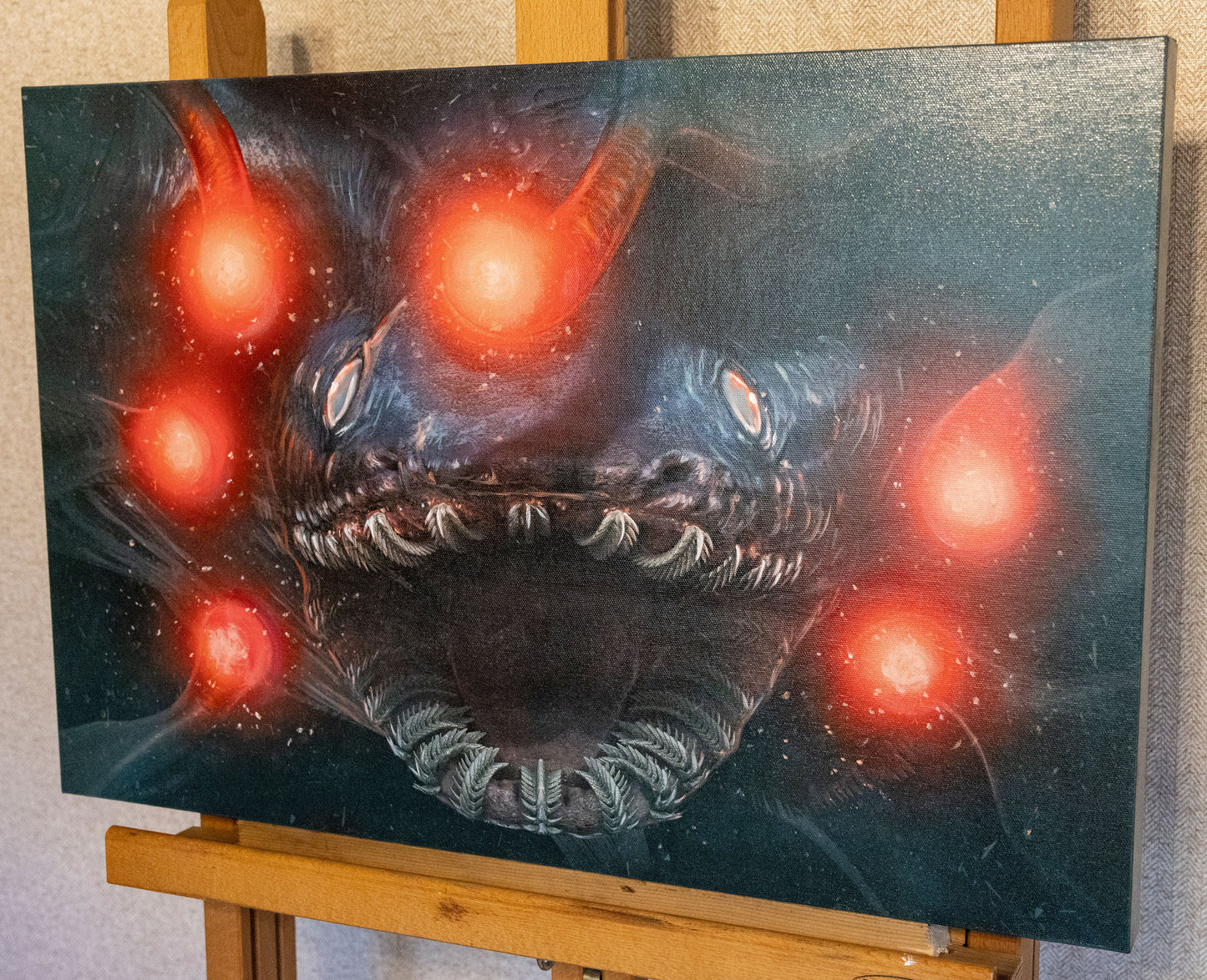 A picture of the canvas on an easel.