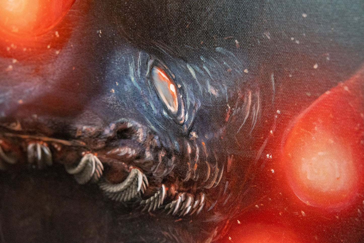 A close up of the eyes and teeth of the creature.
