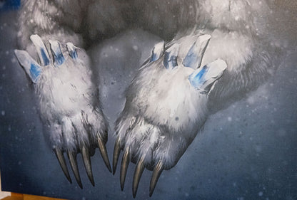 A close up of the bear's paws.