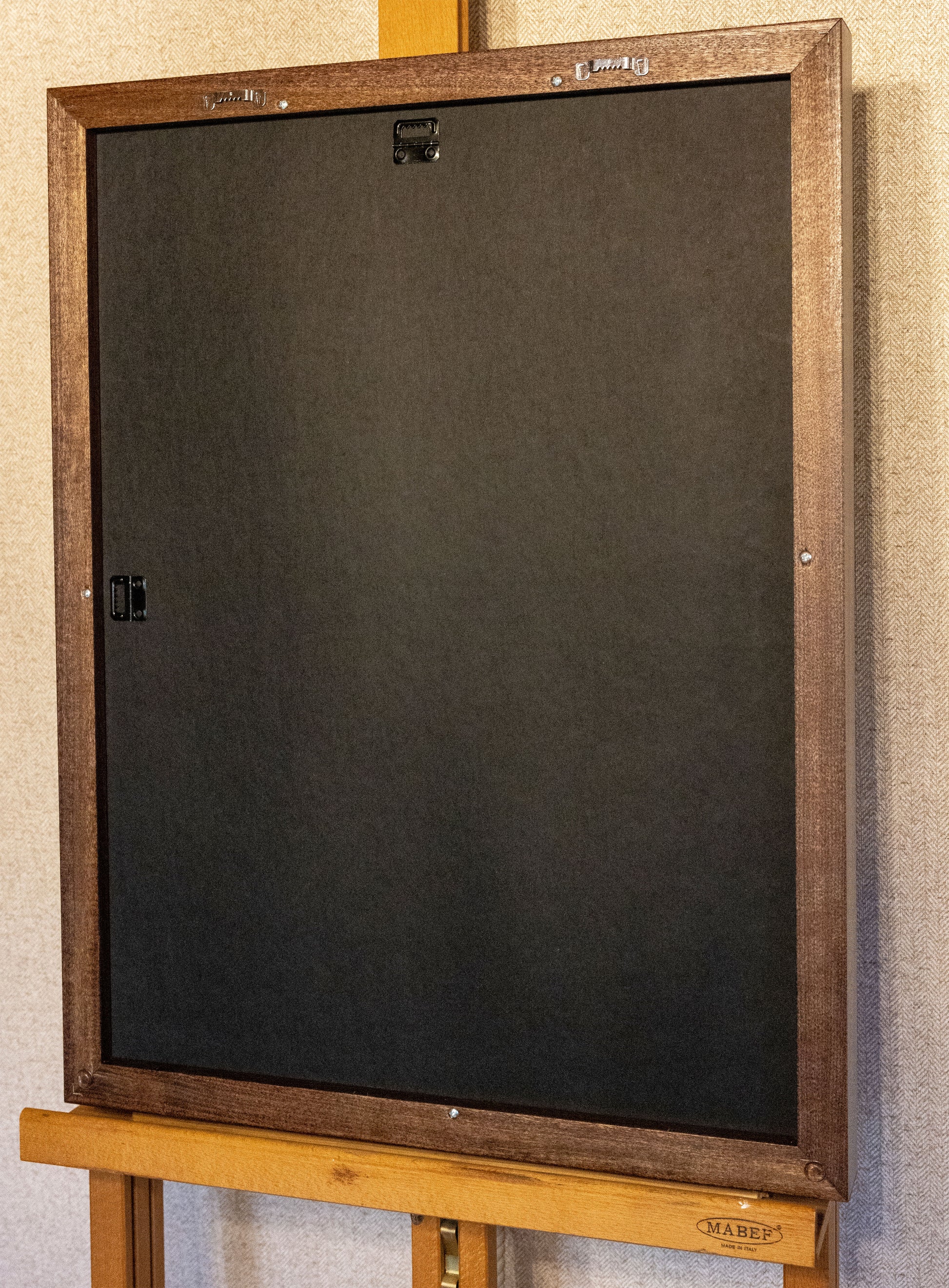 The back of the canvas which has two hanging functions.