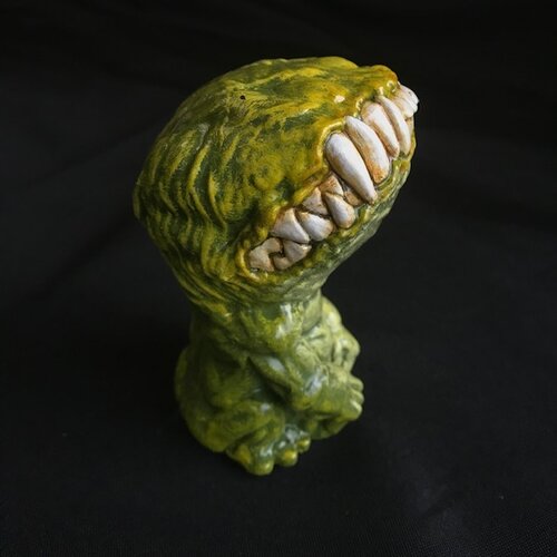 The same creature, from the side. The texture is ribbed and there's a slight shine from reflection.